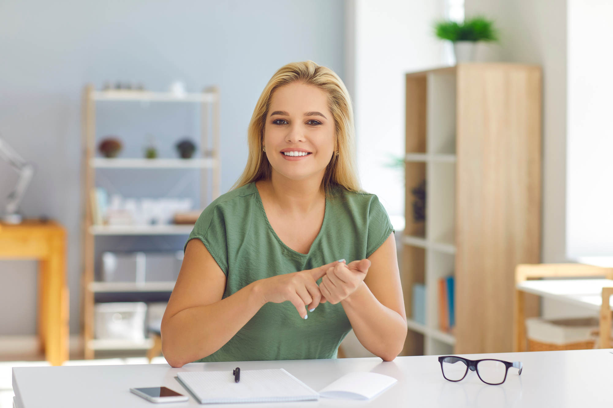 Smiling Teacher or Life Coach Talking to Students or Clients during Online Video Call